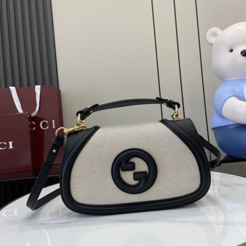 G*u*i top handle bags
